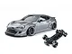 Studio shot of a metal grey 86RB RC drift car body and its matching black chassis on a white background.