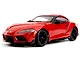 Red Toyota Supra GR RC car model viewed from the front three-quarter angle on a white background.