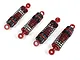 Set of four red and black RC shock absorbers arranged diagonally on a plain white background.