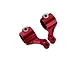 Two red anodized aluminium RC steering hubs with pre-installed white plastic inserts, shown against a plain white background.