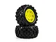 Two Pro-Line Badlands MX MT black rubber tyres mounted on bright yellow split-six rims against a white background.