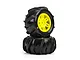 Pro-Line Dumont paddle tyres mounted on yellow split-six wheels, stacked against a white background.
