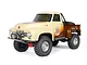 Axial SCX10 II 1955 Ford F-100 RC rock crawler in a two-tone cream and brown paint scheme with off-road tires and a roll bar.