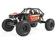 Axial Capra 1.9 Unlimited Trail Truck RC rock crawler in red, featuring a tube chassis, off-road tires, and detailed driver figures.