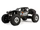 Axial RR10 Bomber 2.0 1/10 scale RC rock racer in grey, featuring a roll cage, off-road tires, and sponsor decals on a white background.