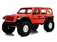 An orange Axial SCX10 III Jeep JLU Wrangler RC rock crawler viewed from a front three-quarter angle against a white background.