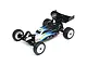 A studio shot of a Losi Mini-B 2.0 1/16 scale 2WD RC buggy in black with white and yellow accents, shown from a high-angle front three-quarter view.