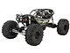 Axial RBX10 Ryft 4X4 rock bouncer RC car in black, featuring a tube chassis, large off-road tires, and detailed driver figures.