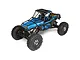 A Losi Night Crawler SE 1/10 scale RC rock crawler in blue, featuring a roll cage, off-road tires, and detailed driver figures.