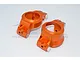 Two orange anodized aluminium front hub carriers (C-hubs) for RC cars, featuring white plastic bushings, set against a white background.