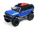 A blue Axial SCX24 2021 Ford Bronco RC rock crawler viewed from a high angle against a white background.
