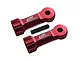 Two red anodized aluminium GPM Racing middle shaft heads with a single black grub screw on a white background.