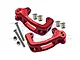 A pair of red anodized aluminium GPM Racing steering hub carriers with included screws, nuts, and metal bushings on a white background.