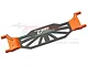 GPM Racing orange aluminium and carbon fibre battery cover for RC cars, featuring a central carbon plate with orange metal ends.
