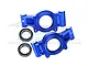 A pair of blue anodized aluminium RC rear hubs with GPM branding and two metal ball bearings on a white background.