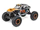 Axial UTB18 Capra Unlimited RC rock crawler in grey with orange Fox Racing livery, featuring a tube chassis and off-road tires.
