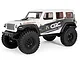 A white Axial SCX24 2019 Jeep Wrangler JLU CRC RC rock crawler on a white background.