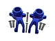 A pair of blue anodized aluminium steering hubs for an RC car, accompanied by several small metal screws, set against a white background.