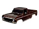 A brown 1/10 scale Traxxas 1979 Ford F-150 RC truck body shell, pre-painted with detailed grille, headlights, and side mirrors.