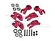 A set of red anodized aluminium RC car hub carriers and steering knuckles with included bearings, screws, and lock nuts.