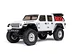 A white Axial SCX24 Jeep Gladiator RC rock crawler shown from a front three-quarter angle against a white background.