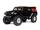 A black Axial SCX24 Jeep Gladiator RC rock crawler shown from a front three-quarter angle against a white background.