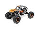 Axial UTB18 Capra 1/18 scale RC rock crawler in grey and orange with Fox branding, shown from a front-quarter angle on a white background.