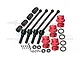 A set of GPM Racing RC car parts including four black steel CVD driveshafts, four red aluminium wheel hex hubs, and various small hardware components.