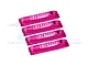 Four fuchsia GPM Racing shock wraps for RC cars arranged in a row against a white background.