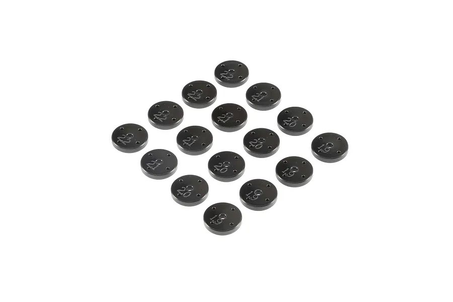 A collection of black metal RC shock pistons arranged in a grid on a white background, each marked with size numbers.