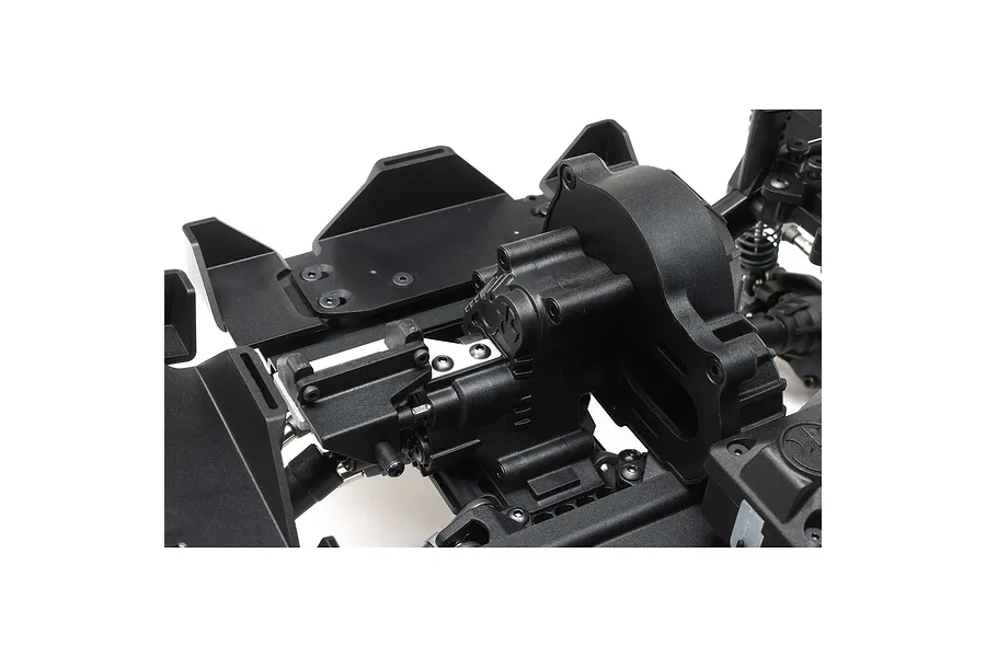 Close-up of an Axial RC vehicle chassis showing the transmission and DIG conversion mechanism installed.