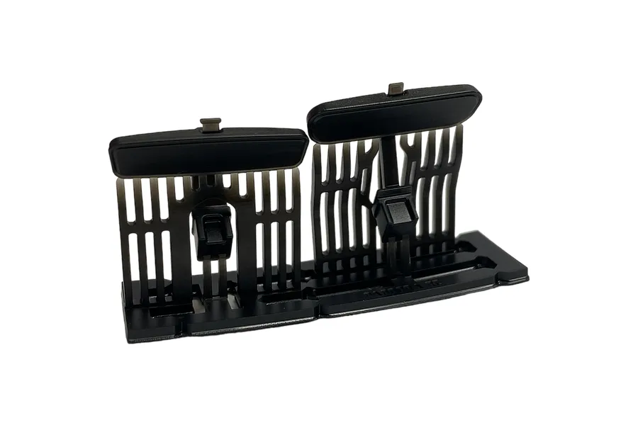 A pair of black plastic RC car side mirrors on a sprue tree, manufactured by Pandora RC.