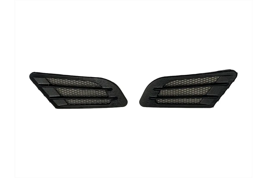 Two black plastic 1/10 scale fender ducts with mesh inserts for RC car bodies.