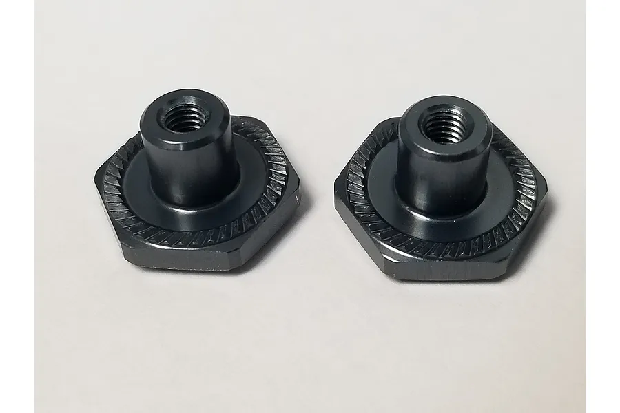 Two black metal serrated wheel nuts for RC vehicles, shown side-by-side on a plain white background.