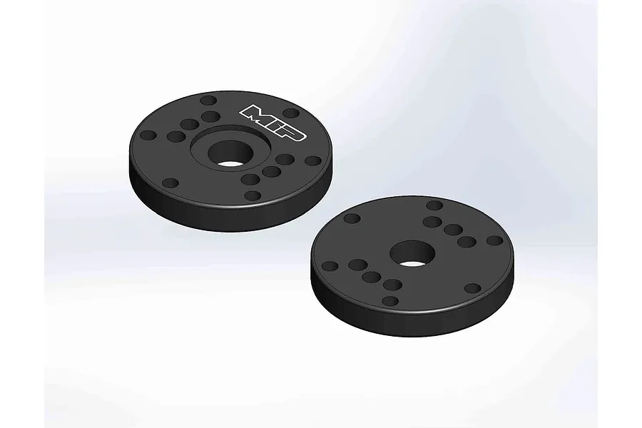 Two black MIP Bypass1 shock pistons with multiple holes, shown from a top-down isometric angle on a white background.