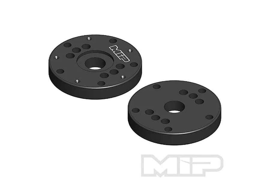 Two black circular MIP Bypass1 shock pistons with multiple holes, displayed against a white background.