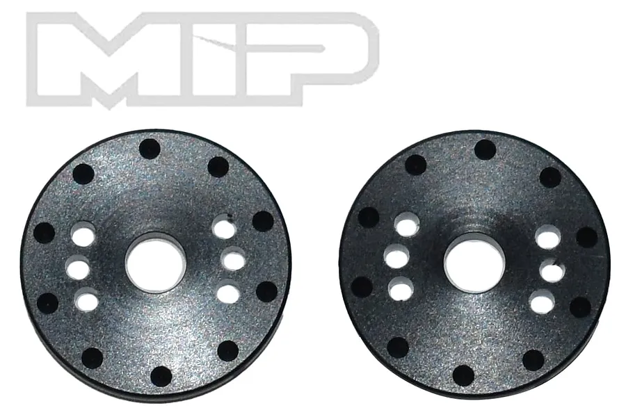 Two black circular MIP shock pistons with multiple holes arranged in a pattern, shown against a white background.