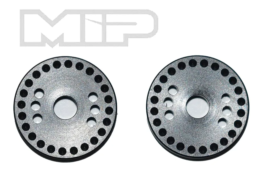Two circular black metal RC shock pistons with 24 holes arranged in a ring, displayed against a white background with the MIP logo above.