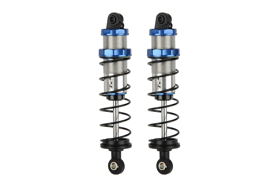Two Pro-Line Pro-Spec assembled RC shock absorbers with silver threaded bodies, blue collars, and black springs against a white background.