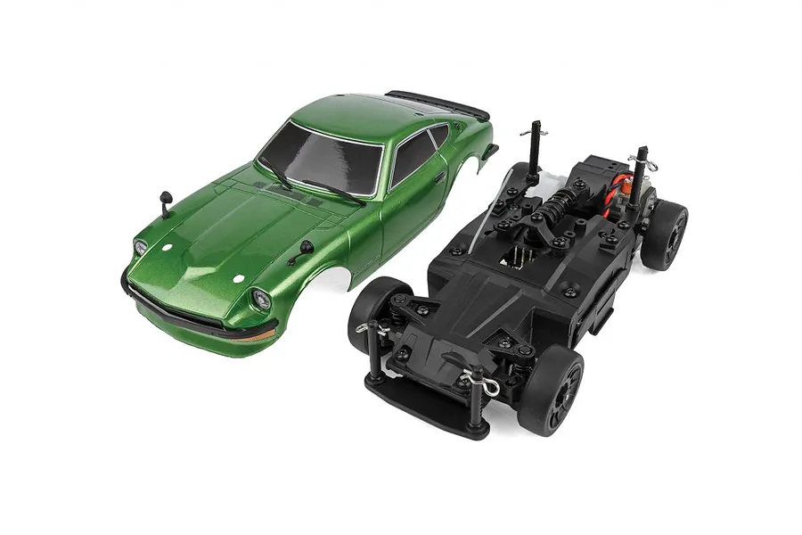 Team Associated SR27 Datsun 240Z RC car body shell in metallic green next to its black plastic chassis on a white background.