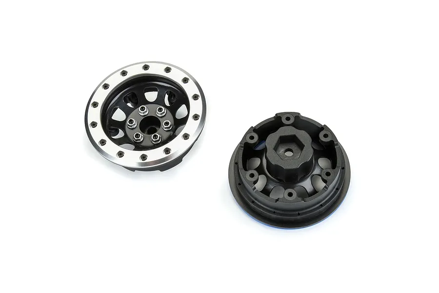 Two Pro-Line 2.9 inch Steelies RC wheels shown from front and back angles, featuring a silver outer ring and black center hub.