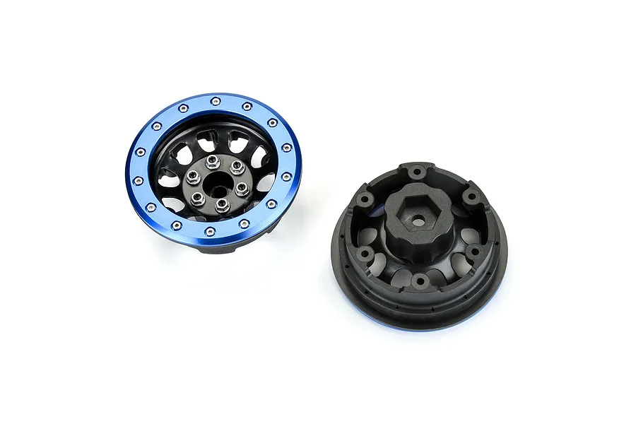 Two Pro-Line 2.9 inch Steelies RC wheels with blue anodized outer rings and black centers shown from front and back angles.