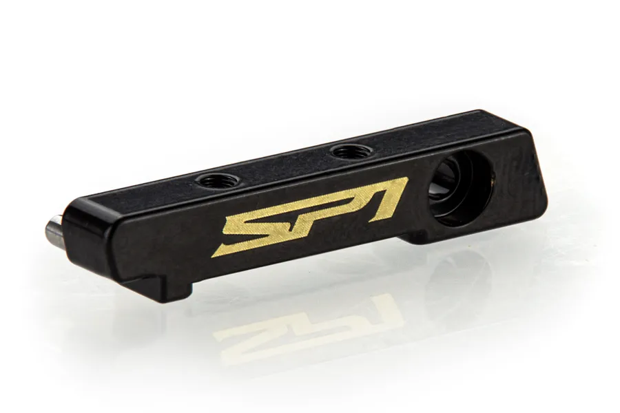 A black RC Maker brass floating electronics plate bulkhead with gold SP1 branding on a white background.