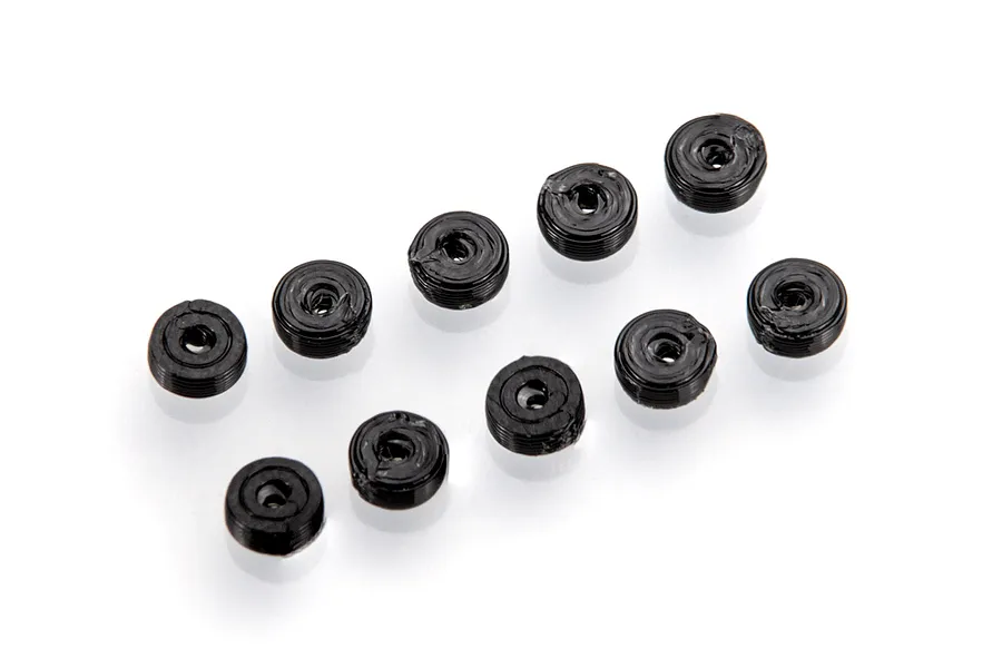 Ten small black cylindrical RC anti-roll bar stoppers arranged on a white background.