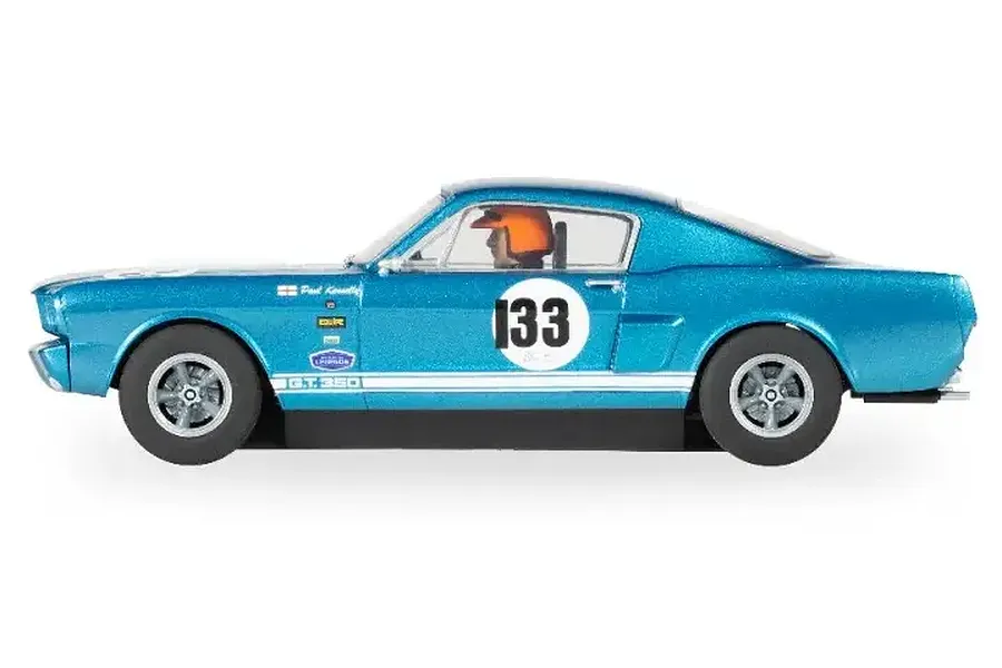 Side profile of a metallic blue Scalextric 1/32 scale Shelby Mustang GT350 slot car, number 133, driven by Paul Kenelly.