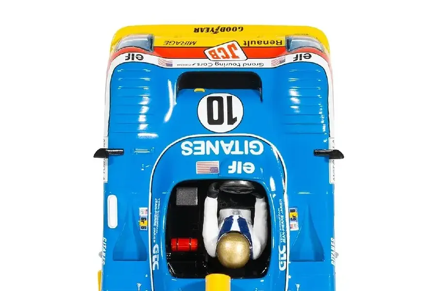 Top-down view of a blue and yellow Scalextric 1/32 scale Mirage GR8 slot car with number 10, featuring Gitanes and Elf branding on a white background.