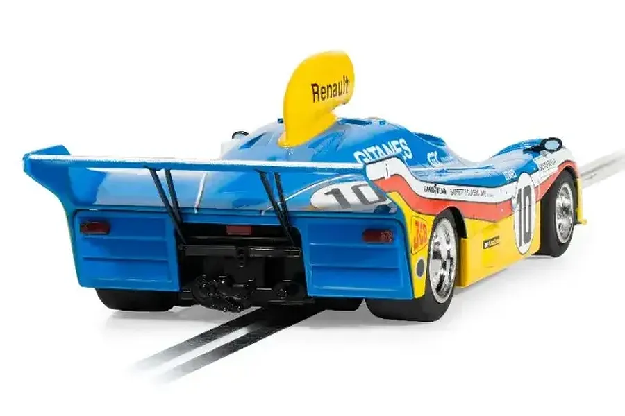 Rear three-quarter view of a blue and yellow Scalextric 1977 Mirage GR8 slot car on a track.