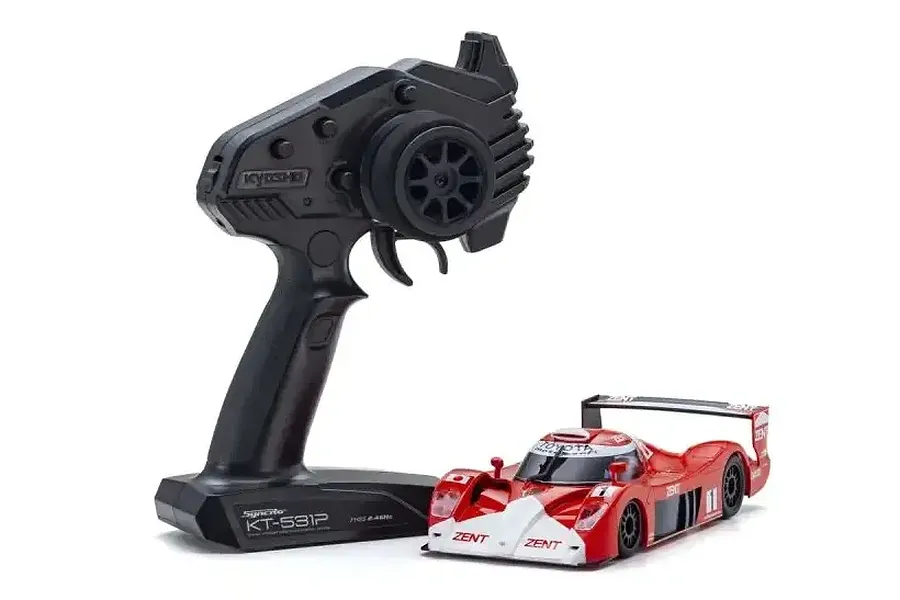 Kyosho Mini-Z Toyota GT-One TS020 RC car in red and white livery next to a black Kyosho Syncro KT-531P radio transmitter.