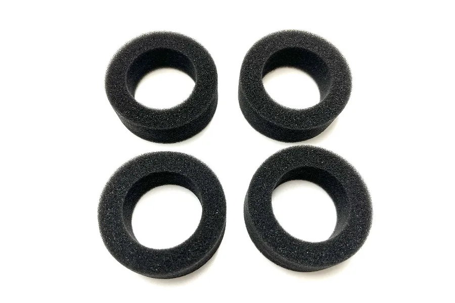Four black circular foam tyre inserts arranged in a two-by-two grid on a white background.