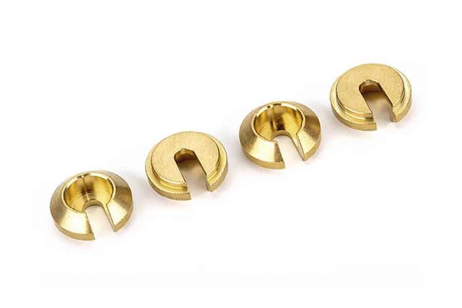 Four small, circular brass shock absorber retainers with a U-shaped slot, arranged in a row on a white background.